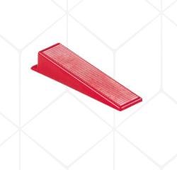 Cale de serrage rouge pour système de nivellement de carrelage.